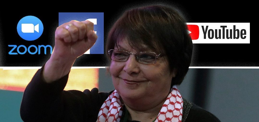 Photo of Leila Khaled wearing a keffiyeh with fist raised in the air, logos of Zoom, Facebook, and YouTube in the background.
